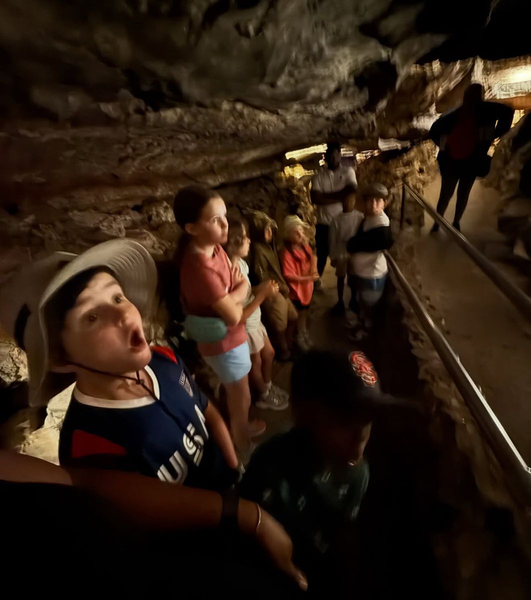Camper amazed inside a cave