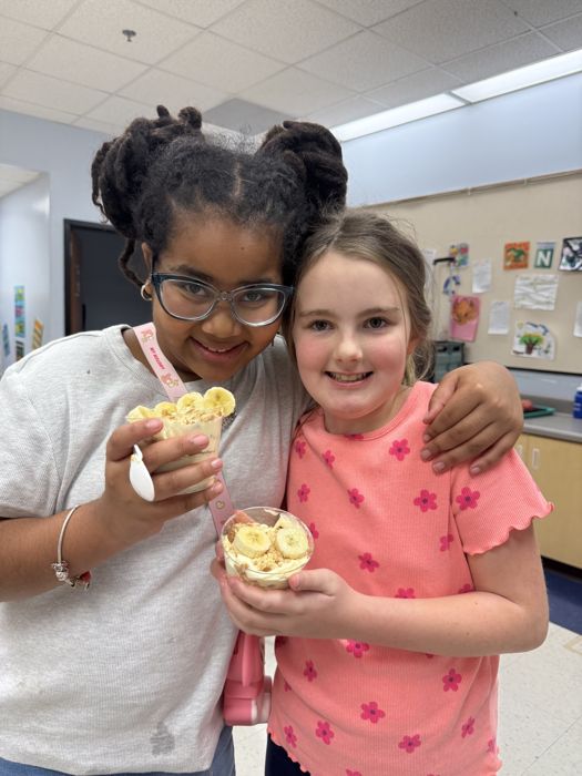 Students with banana pudding cups they made
