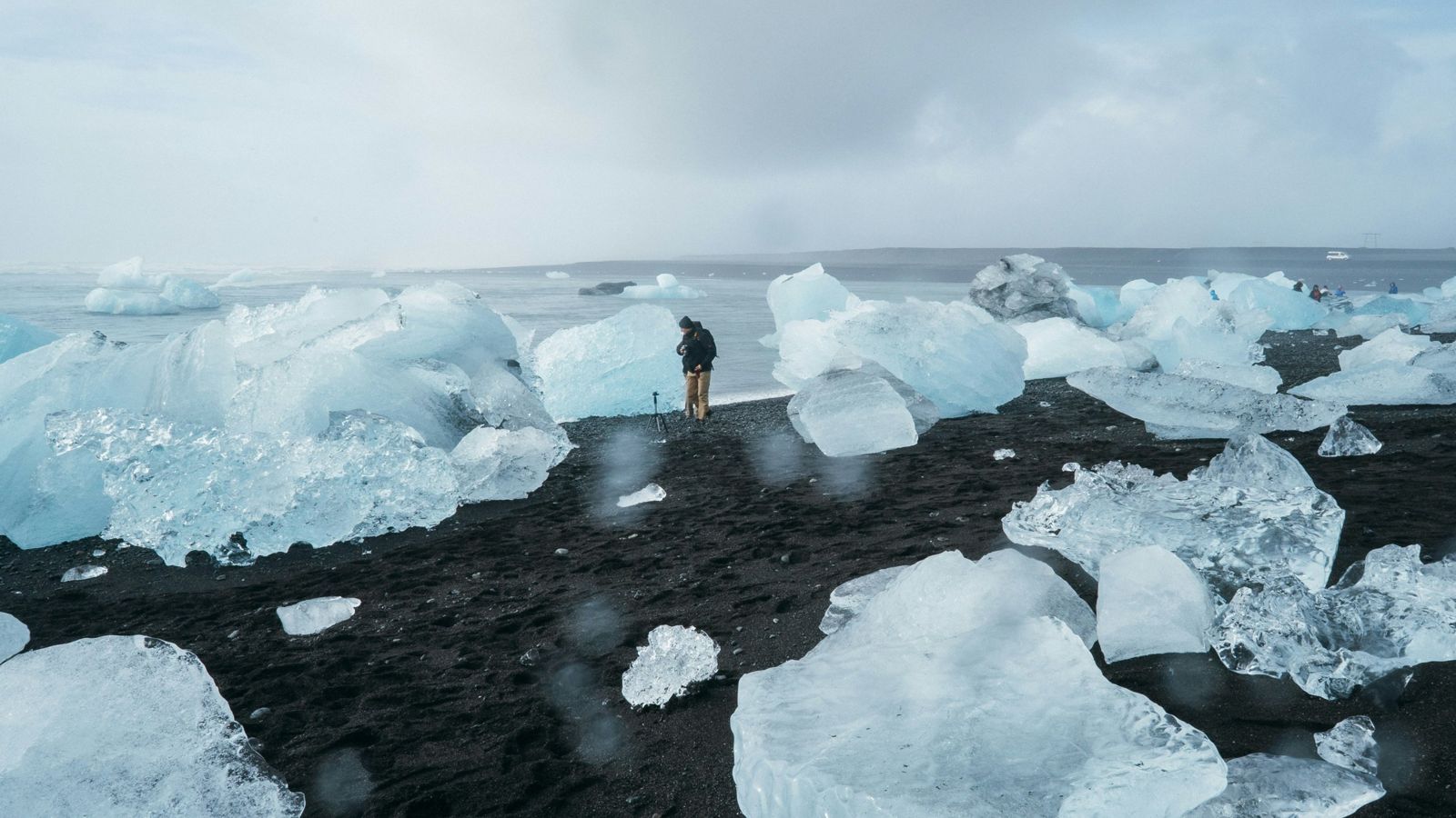 Chunks of glacier ice on a black-sand beach